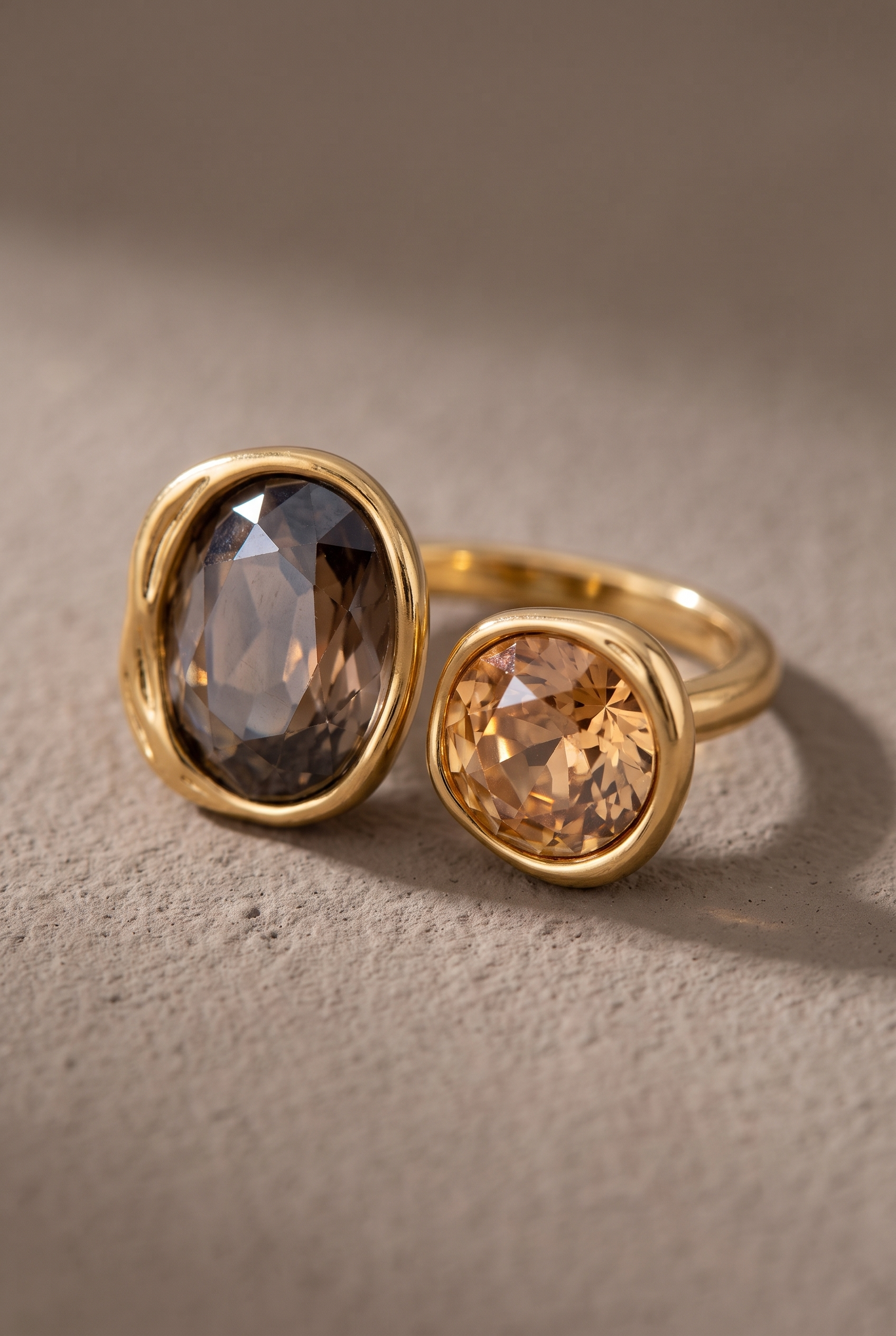 Close-up of the smoky oval and champagne round crystals in organic bezels
