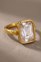 Close-up of the bezel-set emerald-cut clear stone